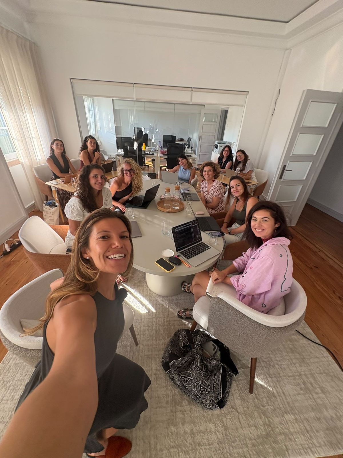 A workshop group around an oval table